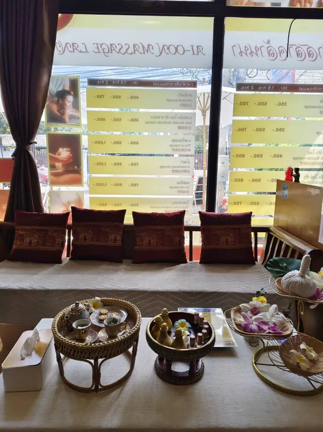 Window seating and a refreshment table with tea sets inside Ai Oon Massage Lanna, Chiang Mai