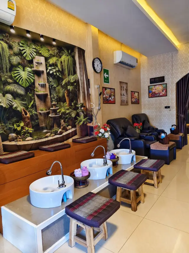 Foot massage station with white basins and recliners at Ai Oon Massage Lanna, Chiang Mai